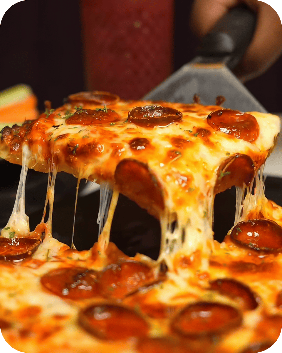 Delicious pepperoni pizza with melted cheese and crispy crust at Albatross. Perfect for a casual din.