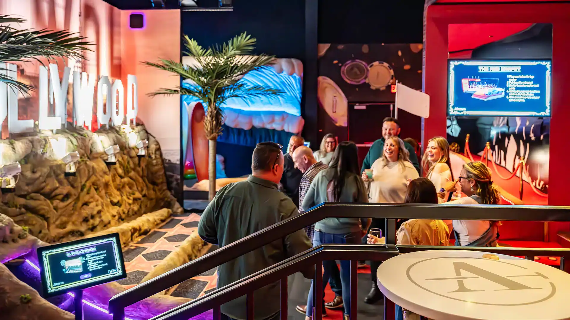 Indoor entertainment area at Albatross with themed decor and guests enjoying activities.